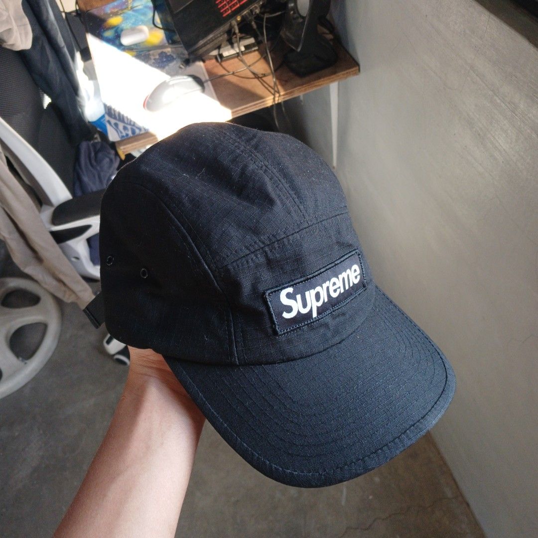 Supreme 5 panel Camp Cap (Category: Caps & Hats) located in Manila. Submitted by joefrey12 (Listing ID 1468334461, Image 3). Description: - Brand: Supreme - Style: Ripstop Camp Cap - Color: Classic Black - Details: Iconic box logo patch on front, adjustable strap closure with plastic buckle, interior US flag tag (Made in U.S.A.) - Condition: Clean structure, minimal wear overall - Perfect for daily streetwear rotation.