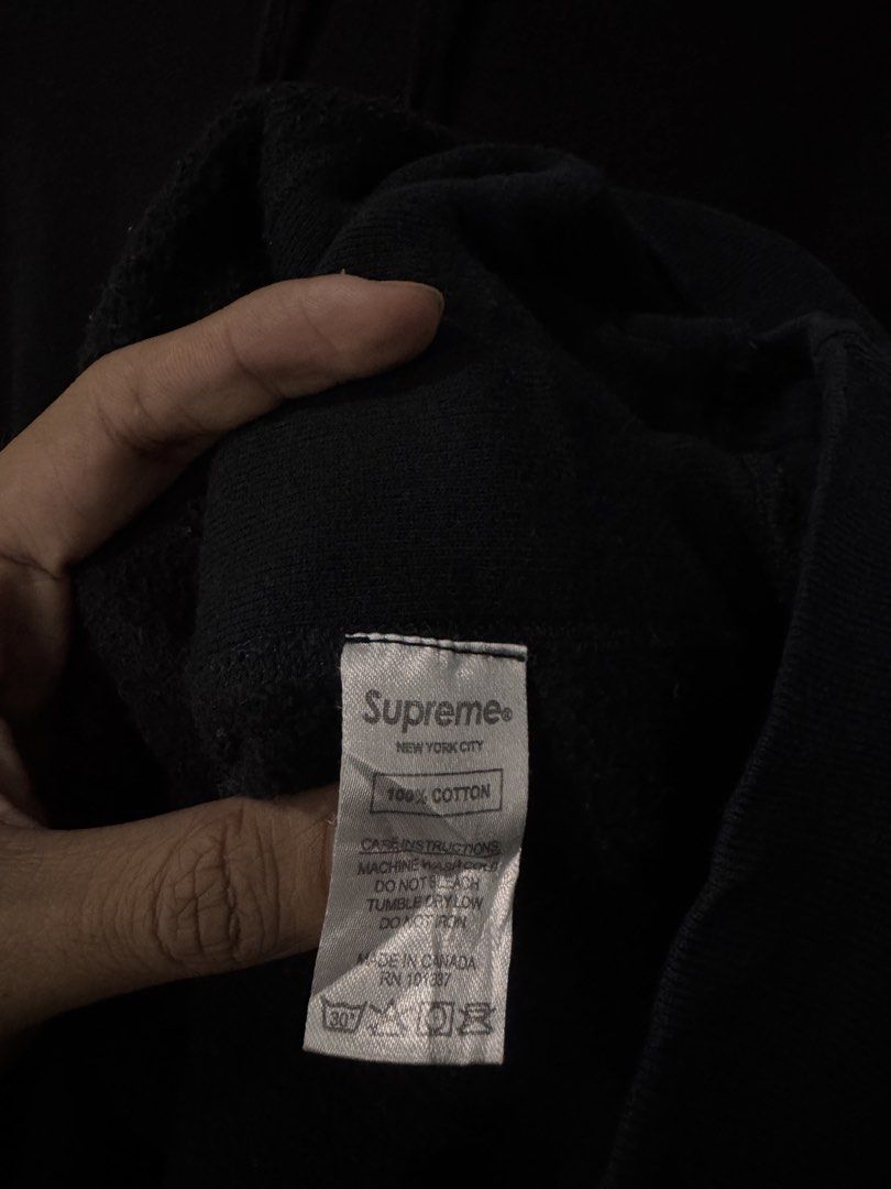 Supreme Arc Logo Hooded Sweatshirt Black (Category: Hoodies) located in Alaminos. Submitted by outfitcheck.ph (Listing ID 1468414720, Image 3). Description: - Brand: Supreme (Made in Canada) - Color: Black with tonal chenille arc logo - Material: 100% heavyweight cotton - Features: Kangaroo pocket, matching drawstrings, ribbed side panels, cuffs, and hem - Condition: Classic streetwear piece with intact interior tags - Shipping or meetups availab
