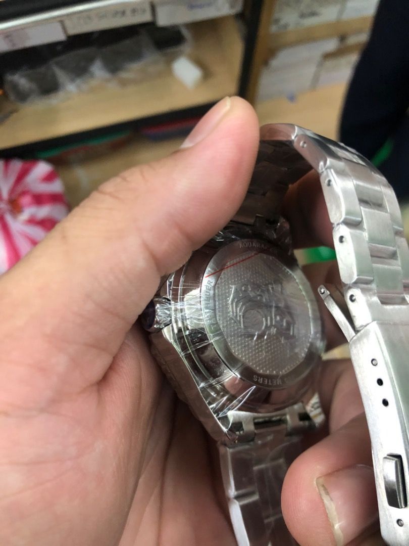 TAG Heuer Aquaracer Watch (Category: Luxury Watches) located in Manila. Submitted by odingepi-23571 (Listing ID 1468478673, Image 3). Description: - Brand: TAG Heuer Aquaracer - Movement: Chronometer certified automatic - Condition: Brand new, still wrapped in protective plastic film - Dial: Black wave pattern with silver hands, blue sweep seconds hand, and date window with magnifier at 3 o'clock - Bezel: Rotating black bezel - Material: Stainles