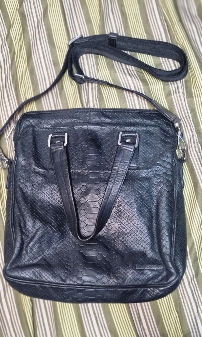 Tanino Laborghini Men's Sling Bag (Category: Luxury Bags & Wallets) located in Manila. Submitted by myno23lenel (Listing ID 1468369089, Image 1). Description: for sale Tanino Lamborghini Sling/Shoulder bag Phyton Skin ,in good condition, no issue only signs of usage,rare item, hardware Tantino Lamborghini engraved dimes 12"/12" for only 2.7k nego for sure buyers.