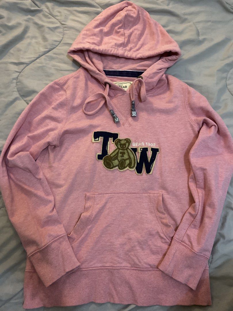 Taoshi Bear Pink Pullover Hoodie Size 165/88A (Category: Coats, Jackets and Outerwear) located in Manila. Submitted by newkkmora98454 (Listing ID 1468316029, Image 2). Description: - Color/Brand: Pink Taoshi Bear hoodie - Design: Cute bear patch with 'Bear 1902' lettering on the front - Features: Adjustable drawstring hood and front kangaroo pocket - Material: Soft, warm, and comfortable - Size: 165/88A tag inside .