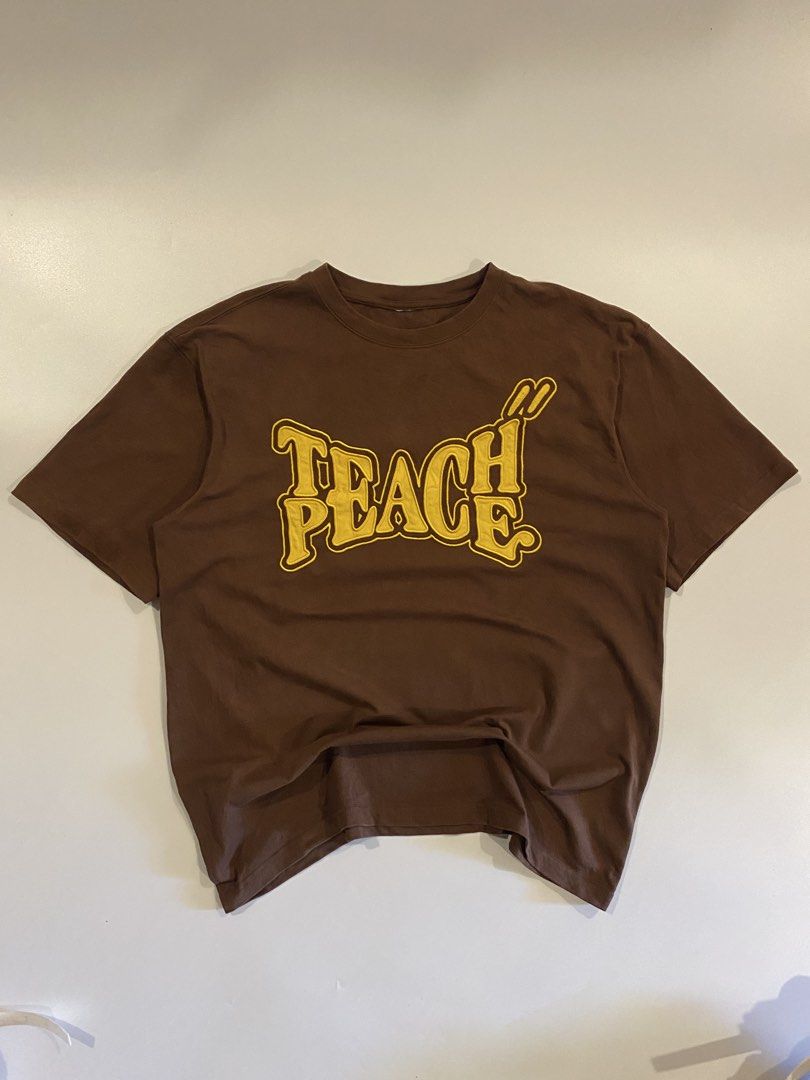 Teach peace embroidered front desgin (Category: Tshirts & Polo Shirts ) located in Iloilo. Submitted by joren_ian (Listing ID 1468306188, Image 2). Description: Teach Peace embroidered front design Size:large Dimes (Length×Width):28x23.5 ₱450 Condition:like new Issue:cut tags.