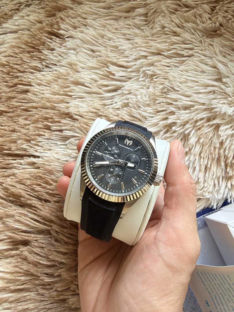 TechnoMarine Sea Dream Watch TM-719022 (Category: Luxury Watches) located in Cainta. Submitted by kath_pl (Listing ID 1468340507, Image 2). Description: - Brand: TechnoMarine - Model: Sea Dream (TM-719022) - Dial: Black textured with fluted bezel - Strap: Black rubber - Movement: Japan movement with stainless steel case back - Water Resistance: 5 ATM / 165 FT - Inclusions: Original white presentation box and warranty paper - Condition: Excellent,