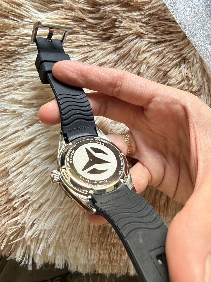 TechnoMarine Sea Dream Watch TM-719022 (Category: Luxury Watches) located in Cainta. Submitted by kath_pl (Listing ID 1468340507, Image 3). Description: - Brand: TechnoMarine - Model: Sea Dream (TM-719022) - Dial: Black textured with fluted bezel - Strap: Black rubber - Movement: Japan movement with stainless steel case back - Water Resistance: 5 ATM / 165 FT - Inclusions: Original white presentation box and warranty paper - Condition: Excellent,