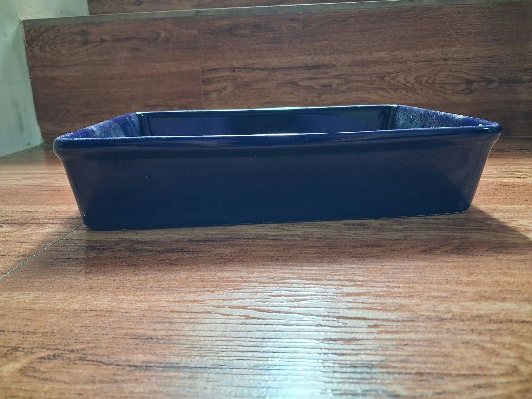 Temp-tations Blue Ceramic Baking Dish (Category: Cookware & Accessories) located in Antipolo. Submitted by ukaylala (Listing ID 1468335532, Image 3). Description: - Brand: Temp-tations - Color/Material: Deep blue ceramic - Dimensions: Approx. 7 x 9.5 inches (rectangular with high sides) - Ideal Use: Great for oven cooking, baking, and casseroles Preferably yung malapit sana kasi babasagin yung item. Location: Antipolo .