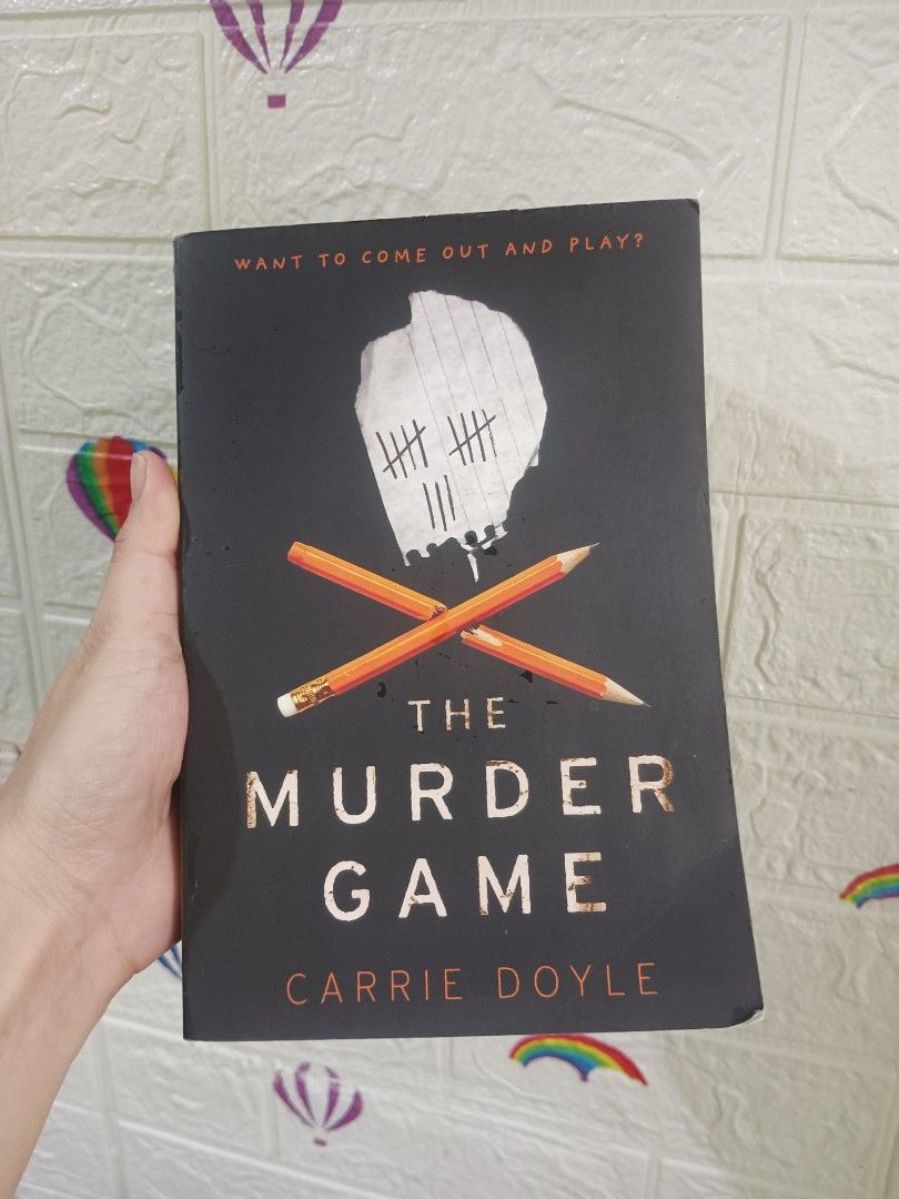 The Murder Game by Carrie Doyle Paperback Novel (Category: Storybooks) located in Manila. Submitted by french_mitchbooks20 (Listing ID 1468317857, Image 1). Description: - Title: The Murder Game - Author: Carrie Doyle - Genre: Thriller / Mystery - Format: Standard paperback - Design: Black cover with crossed pencils and tally marks graphic - Condition: Clean pages, excellent read - Perfect for suspense and mystery lovers.