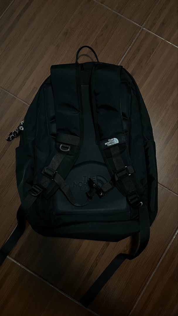 The North Face Black Backpack (Category: Backpacks) located in Manila. Submitted by cansitcanton (Listing ID 1468418817, Image 2). Description: - Brand: The North Face - Color: Classic Black - Condition: Clean inside and out, zippers work smoothly - Storage: Multiple compartments with built-in laptop sleeve and interior mesh zipper pocket - Exterior: Practical front bungee cords - Comfort: Padded shoulder straps with sternum strap and embossed su