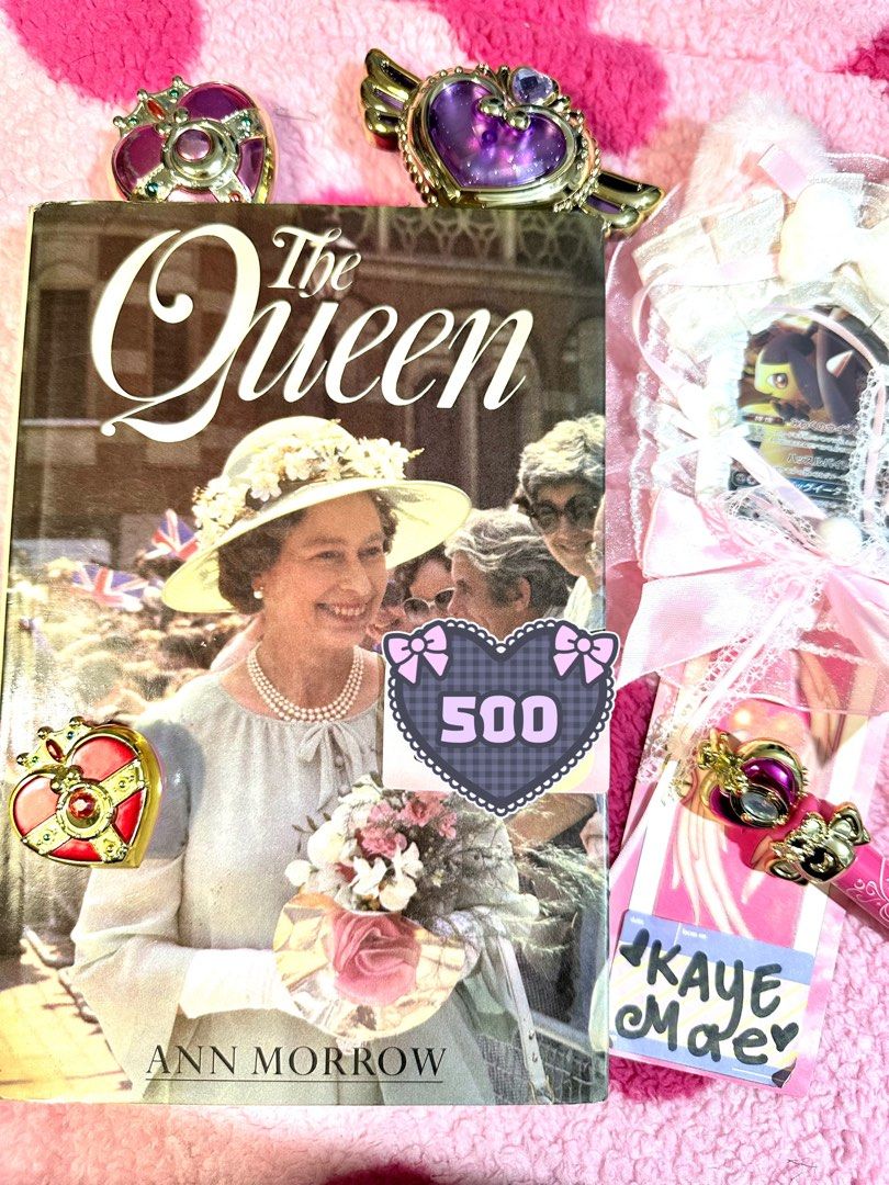 The Queen by Ann Morrow biography book (Category: Storybooks) located in Adams. Submitted by precurekaei (Listing ID 1468370194, Image 1). Description: - Title: The Queen by Ann Morrow - Format: Hardcover biography - Cover: Queen Elizabeth II in her iconic yellow hat, pearls, and flowers - Condition: Clean pages inside - Perfect for: Royal family fans and collectors.