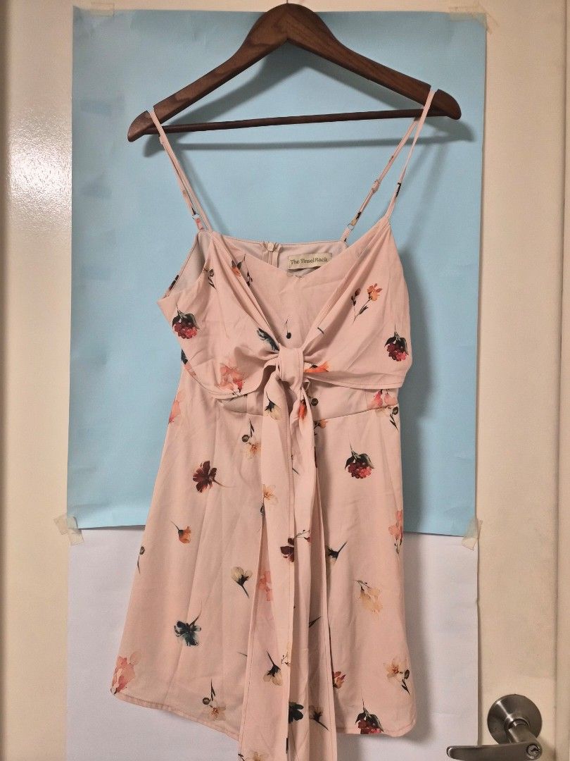 The Tinsel Rack Floral Print Romper Size L (Category: Rompers) located in Manila. Submitted by prelovedbyc.hannah (Listing ID 1468350968, Image 1). Description: - Brand: The Tinsel Rack - Style: Floral romper in pastel pink - Size: L (tag attached) - Details: Adjustable spaghetti straps, front tie ribbon, back zip closure - Perfect for: Casual outings and weekend dates.