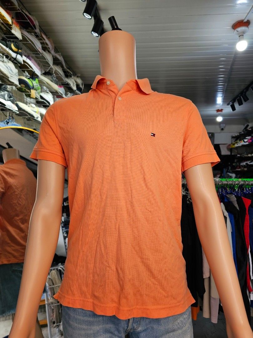 the Tommy Hilfiger 1985 Regular Fit Polo. (Category: Tshirts & Polo Shirts ) located in Baguio. Submitted by kayeonlineshop (Listing ID 1468343776, Image 2). Description: orange Tommy Hilfiger men's polo shirt.
