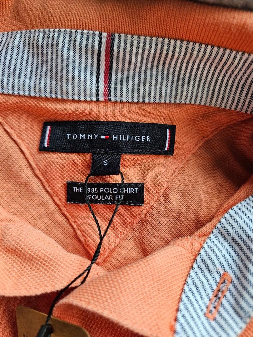 the Tommy Hilfiger 1985 Regular Fit Polo. (Category: Tshirts & Polo Shirts ) located in Baguio. Submitted by kayeonlineshop (Listing ID 1468343776, Image 3). Description: orange Tommy Hilfiger men's polo shirt.