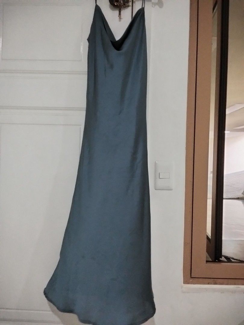 The Underground Designer Slip Dress (Category: Dresses) located in Manila. Submitted by jeansuaco942346 (Listing ID 1468329450, Image 1). Description: - Brand: The Underground Designer - Color: Dark Grey - Material: Smooth satin-like fabric - Design: Cowl neck with thin straps - Length: Long midi / maxi - Condition: Excellent / Like new - Perfect for: Date nights, parties, or casual chic looks - Mode of Payment: GCash, BPI - Shipping: Via J&T Exp