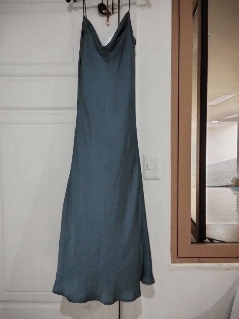 The Underground Designer Slip Dress (Category: Dresses) located in Manila. Submitted by jeansuaco942346 (Listing ID 1468329450, Image 3). Description: - Brand: The Underground Designer - Color: Dark Grey - Material: Smooth satin-like fabric - Design: Cowl neck with thin straps - Length: Long midi / maxi - Condition: Excellent / Like new - Perfect for: Date nights, parties, or casual chic looks - Mode of Payment: GCash, BPI - Shipping: Via J&T Exp