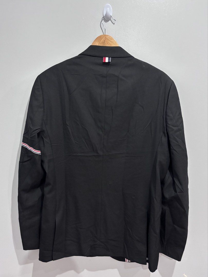 Thom Browne Blazer With Striped Sleeves (Category: Luxury Apparel) located in Dumaguete. Submitted by dgte.grails (Listing ID 1468365221, Image 2). Description: Thom Browne Blazer With Striped Sleeves 21 width 30 length Good as new! 10/10 condition 7,500+sf pm.
