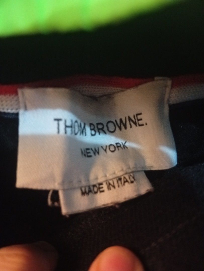 Thom Browne Sweatpants (Category: Joggers) located in Bulacan. Submitted by ukaybrandedshop (Listing ID 1468351725, Image 3). Description: Thom Browne 4-Bar Sweatpants - MADE IN ITALY - Navy Size 3 Fits 32-34 | W 32-34 | L 40.5 | LO 6 Condition 9/10 - Colorate 9.5 No butas, garter goods, complete tags Issue: minimal stain sa white bar only (washable) Details: RWB tab, metal aglet, 4-bar, hem tag, washtag Made in Italy - 100% Authentic ₱1,500 + SF
