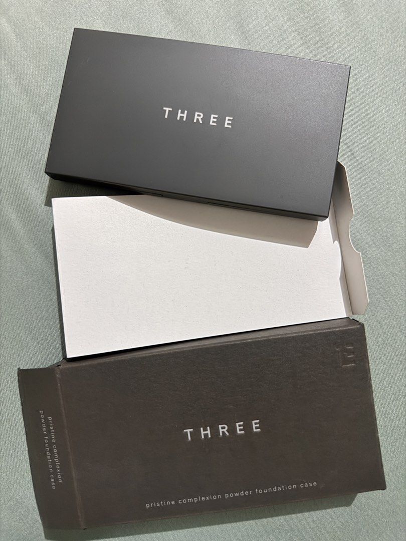 THREE Pristine Compact Case for Powder Foundation (Brand New w/ Box) (Category: Makeup) located in Pili. Submitted by nthlzam (Listing ID 1468420677, Image 1). Description: Authentic THREE Pristine Complexion Powder Foundation Case imported from Japan. Includes mirror and dual compartment design for foundation refill pan and applicator/sponge. Note: Sale includes the empty compact case and box only (refill powder and sponge not included)..