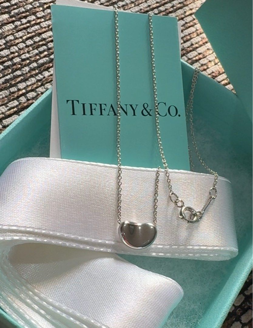 Tiffany & Co. Small Bean Necklace (Category: Necklaces) located in Caloocan City. Submitted by jsa_kawaii (Listing ID 1468325696, Image 1). Description: Authentic Tiffany & Co. Small Bean necklace 16” chain Silver 925 With classic box Excellent condition 8880 + SF Box, ribbon & cards not included for photo purpose only .