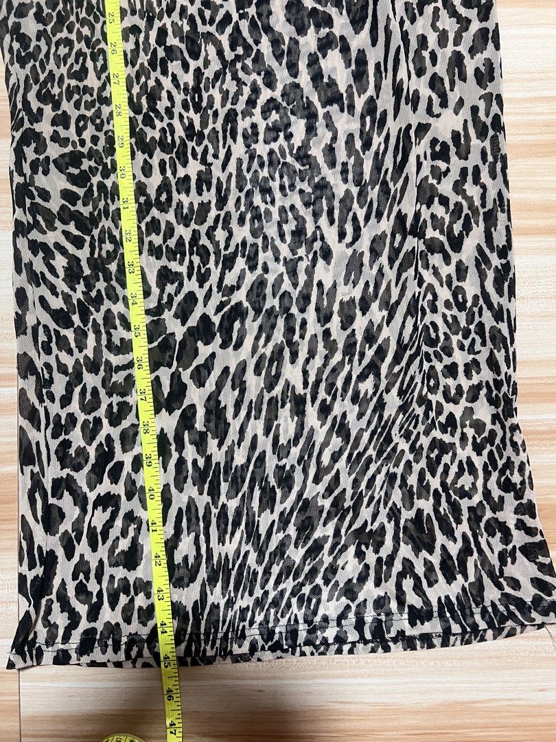 Tiffany & Grey Leopard Print Mesh Dress Size M (Category: Dresses) located in Manila. Submitted by jk2578 (Listing ID 1468308662, Image 3). Description: - Brand: Tiffany & Grey - Style: Leopard print midi dress with long sleeves and round neckline - Material: Sheer, lightweight mesh fabric - Size: Medium (tag attached) - Fit: Flat lay measurements available in photos - Versatility: Great layering piece for casual wear or night outs.