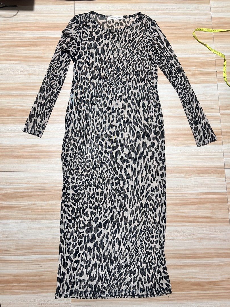 Tiffany & Grey Leopard Print Mesh Dress Size M (Category: Dresses) located in Manila. Submitted by jk2578 (Listing ID 1468308662, Image 1). Description: - Brand: Tiffany & Grey - Style: Leopard print midi dress with long sleeves and round neckline - Material: Sheer, lightweight mesh fabric - Size: Medium (tag attached) - Fit: Flat lay measurements available in photos - Versatility: Great layering piece for casual wear or night outs.