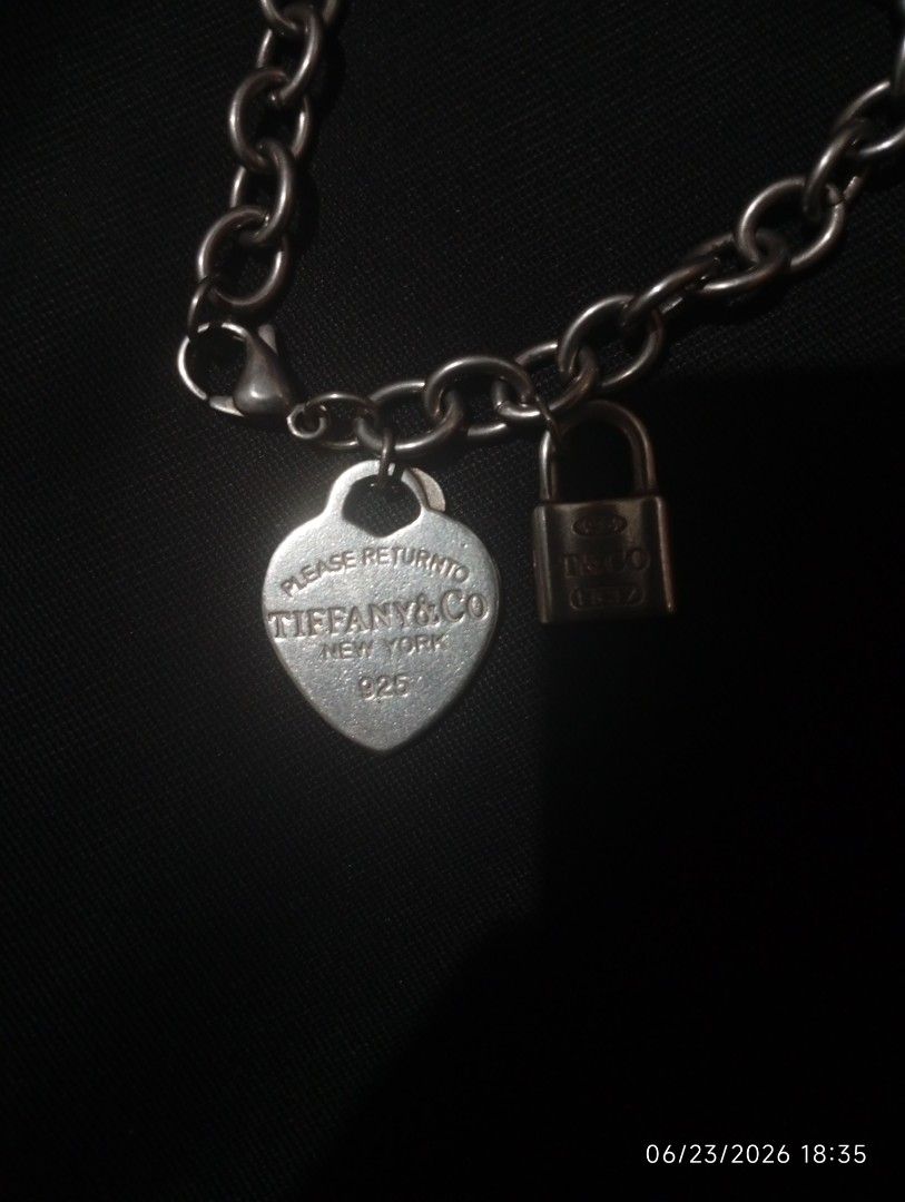 Tiffany Heart Tag Charm Bracelet (Category: Bracelets) located in Puerto Princesa. Submitted by cantfwdricko (Listing ID 1468348602, Image 1). Description: - Brand: Tiffany - Material: Sterling Silver (925 hallmark) - Charms: Return to Tiffany engraved heart tag & T&Co 1837 mini padlock - Closure: Secure lobster clasp - Condition: Classic everyday piece with minor surface hairline scratches from normal wear - Inclusions: Bracelet only.