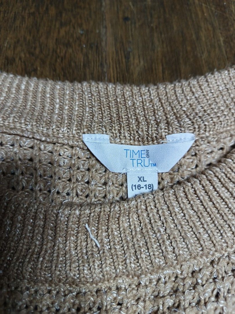 Time And Tru Brown Knitted Sweater (Category: Coats, Jackets and Outerwear) located in Mandaluyong City. Submitted by heatgear (Listing ID 1468425483, Image 2). Description: - Brand: Time And Tru - Color: Brown (great neutral) - Size: XL (fits sizes 16-18) pwede rin sa small to medium women's - Design: All-over textured waffle knit pattern with classic crew neckline - Details: Ribbed collar, cuffs, and hem for a snug fit - Condition/Use: Perfect 