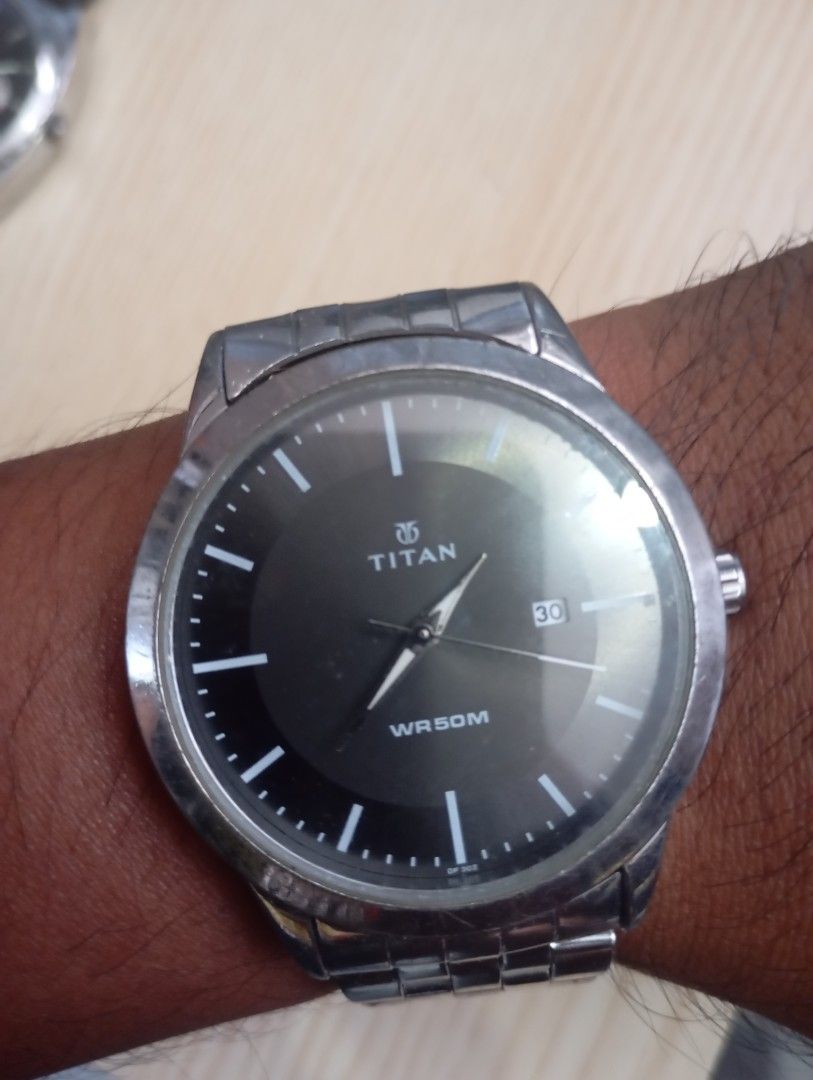 Titan (Category: Men's Watches) located in Las Pinas. Submitted by quick_deals_great_finds2 (Listing ID 1468342086, Image 3). Description: Original good working condition 42mm large fits wrist 7 inches Quartz with battery.