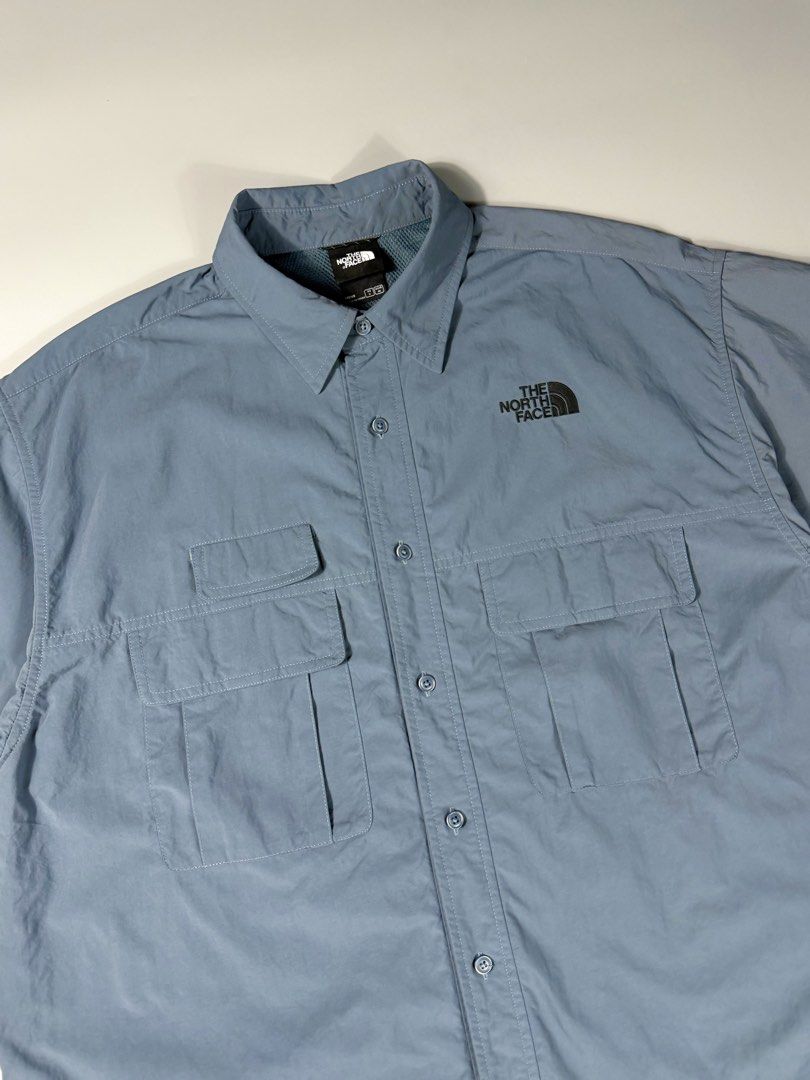 TNF Nylon MultiPocket Button-Up S/S Polo (Category: Shirts) located in Manila. Submitted by whowearsstreetwear (Listing ID 1468458722, Image 3). Description: TNF UE ‘24 Collection Nylon MultiPocket Button-Up S/S Polo (Authentic) - Size: Large fit (measurements in inches) W - 24.5 L - 30 Condition: Excellent - As New Flaw/s: none + shipping fee Location: Manila (Near UST).