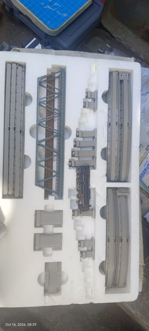 TOMIX 91023 System Up Rail Set C Model Train (Category: Gundam & Model Kits) located in Makati City. Submitted by livelion_c59905 (Listing ID 1468285597, Image 2). Description: - Brand: TOMIX - Model: 91023 System Up Rail Set C - Includes: Tracks, bridge, piers, and a miniature steam locomotive engine piece - Condition: Parts inside are mostly intact and secured in the original styrofoam tray - Packaging: Original box included with heavy wear, te