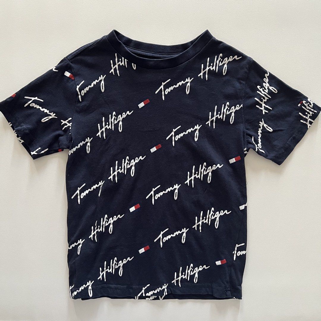 Tommy Hilfiger Navy Blue Shirt (Category: Babies & Kids Fashion) located in Pasay City. Submitted by littlebebekidsstuff (Listing ID 1468312040, Image 1). Description: Size: 5-6y.
