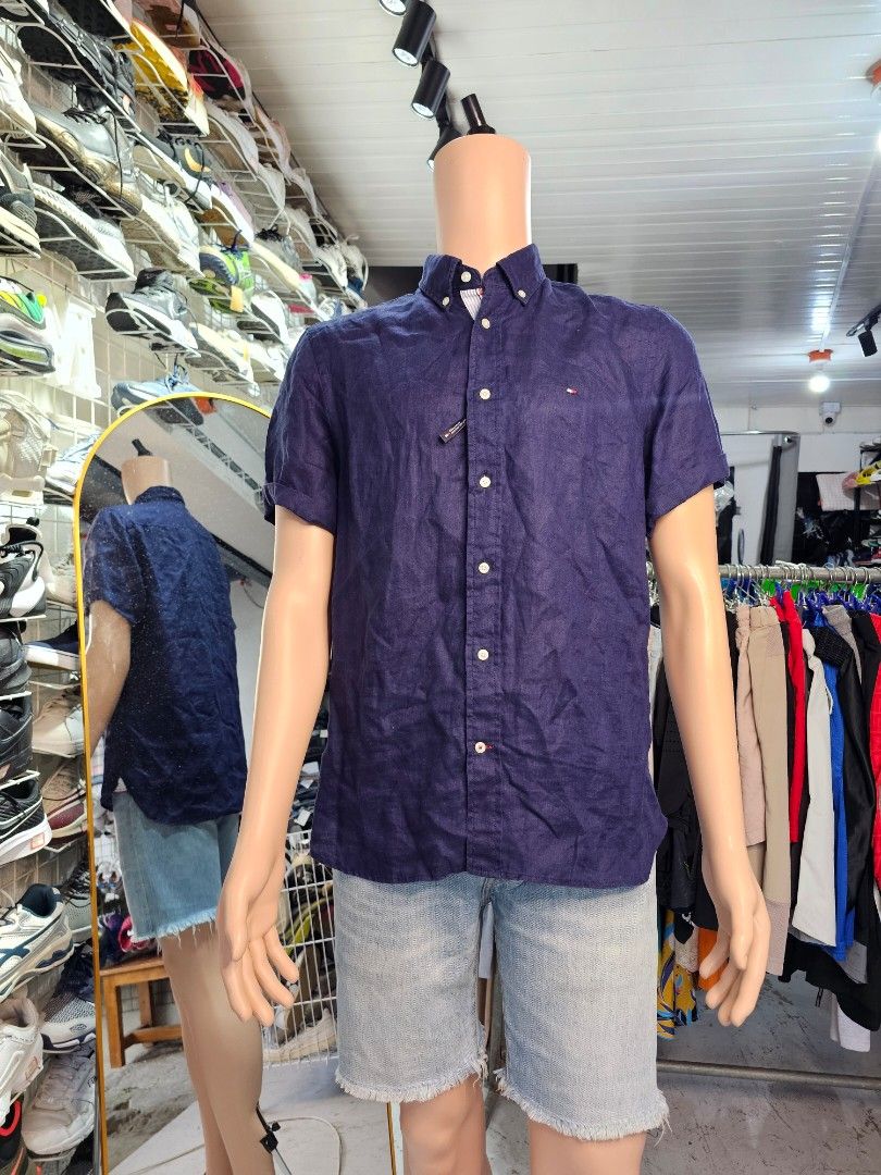 Tommy Hilfiger Polo Shirt (Category: Tshirts & Polo Shirts ) located in Baguio. Submitted by kayeonlineshop (Listing ID 1468308209, Image 1). Description: -dark navy blue short-sleeve button-down shirt by Tommy Hilfiger with a button-down collar and small chest logo embroidery.