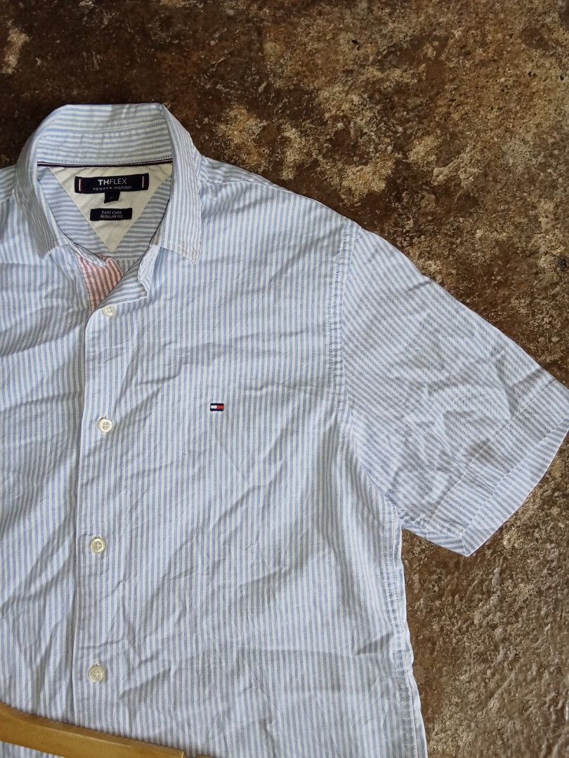 Tommy Hilfiger Short sleve polo (Category: Luxury Apparel) located in Manila. Submitted by omboydante25337 (Listing ID 1468404362, Image 2). Description: authentic Tommy Hilfiger short sleve polo pen stripe combenation Of Blue and White stripe size xs on tag 19x28 best fits Med in great condesyon.