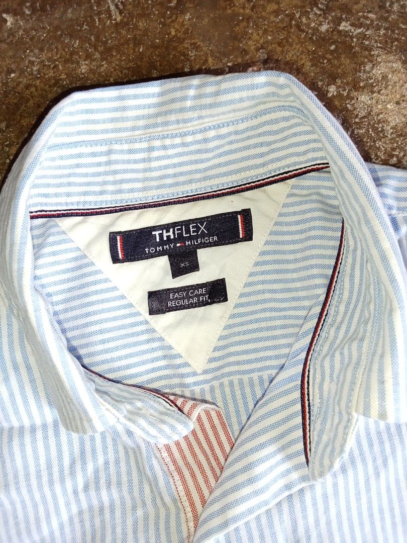 Tommy Hilfiger Short sleve polo (Category: Luxury Apparel) located in Manila. Submitted by omboydante25337 (Listing ID 1468404362, Image 3). Description: authentic Tommy Hilfiger short sleve polo pen stripe combenation Of Blue and White stripe size xs on tag 19x28 best fits Med in great condesyon.