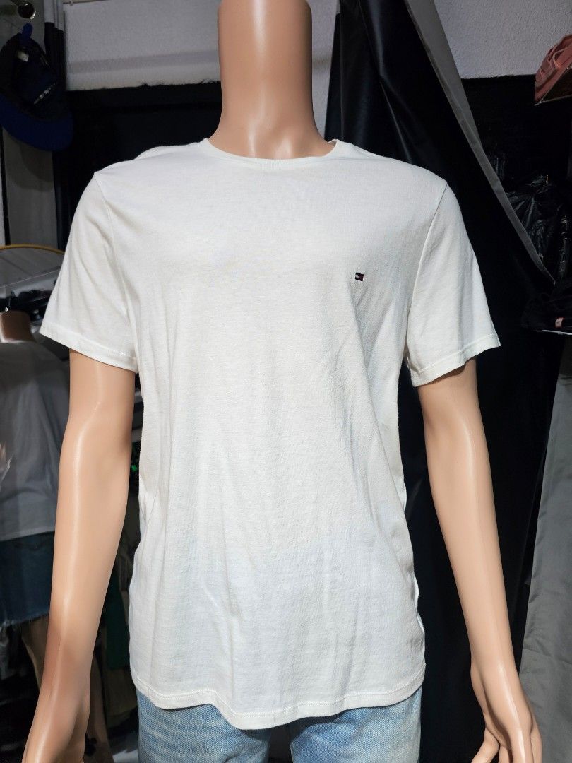 Tommy Hilfiger white shirt (Category: Tshirts & Polo Shirts ) located in Baguio. Submitted by kayeonlineshop (Listing ID 1468333065, Image 2). Description: measurements included in the photos.