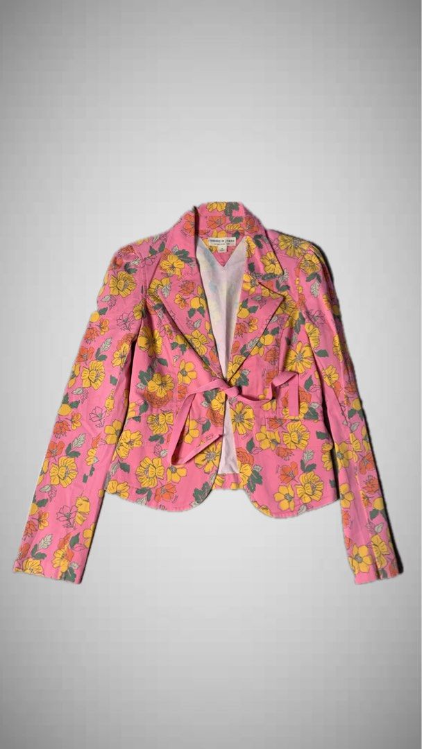 Tommy Jeans Floral Pink Blazer Jacket (Category: Coats, Jackets and Outerwear) located in Manila. Submitted by armamentoj94205 (Listing ID 1468374745, Image 1). Description: - Brand: Tommy Jeans - Size: M - Color/Pattern: Pink with yellow and orange floral print - Features: Long sleeves, lapel collar, front tie closure - Material: Cotton-spandex shell with polyester lining - Condition: Excellent, clean inside tag and lining - Style: Trendy, state