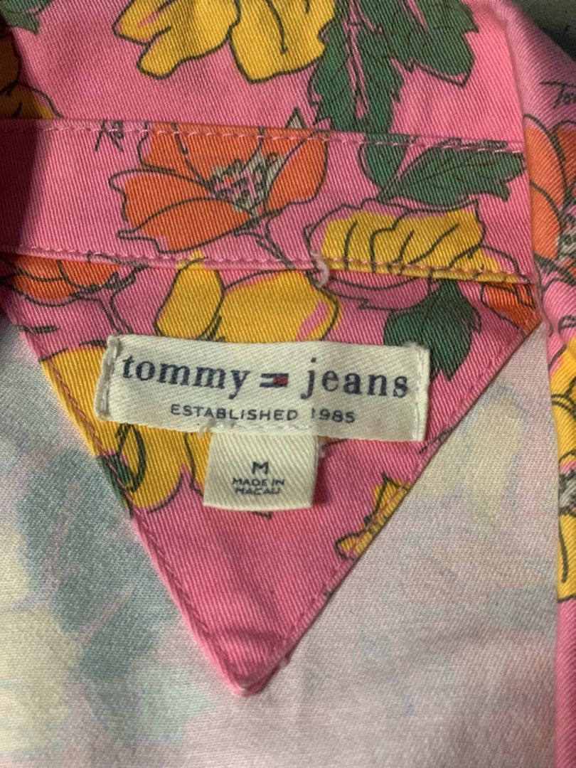 Tommy Jeans Floral Pink Blazer Jacket (Category: Coats, Jackets and Outerwear) located in Manila. Submitted by armamentoj94205 (Listing ID 1468374745, Image 2). Description: - Brand: Tommy Jeans - Size: M - Color/Pattern: Pink with yellow and orange floral print - Features: Long sleeves, lapel collar, front tie closure - Material: Cotton-spandex shell with polyester lining - Condition: Excellent, clean inside tag and lining - Style: Trendy, state