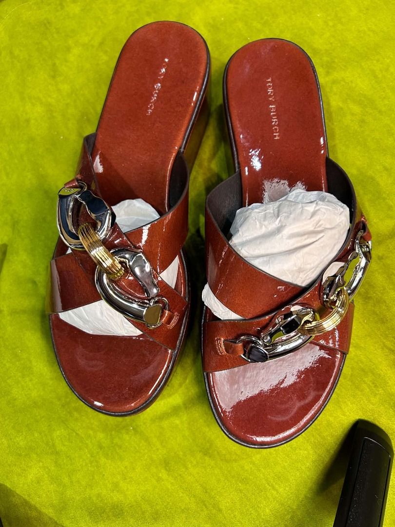 Tory Burch Jessa Platform Sandal. (Category: Sneakers & Footwear) located in Quezon City. Submitted by abk_storemandaluyong25 (Listing ID 1468448004, Image 1). Description: Product Details • Brand: Tory Burch • Model: Jessa Platform Sandal / Jessa Slide • Colorway: Russet Brown / Tan Patent Leather • Design Features: A prominent '90s-inspired platform wedge sole crafted in rich russet brown patent leather, highlighted by crisscross front straps t