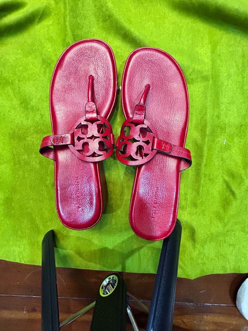 Tory Burch Miller Wedge Sandal (Category: Sneakers & Footwear) located in Quezon City. Submitted by abk_storemandaluyong25 (Listing ID 1468451032, Image 1). Description: Product Details • Brand: Tory Burch • Model: Miller Wedge Sandal / Miller Platform Thong Slide • Colorway: Bright Cherry Red • Materials: Premium pebbled leather upper, leather-wrapped wedge midsole, and a durable rubber outsole. • Design Features: A chunkier, elevated spin on th