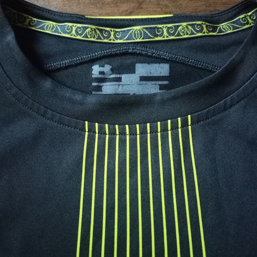 Tottenham Hotspur Under Armour Away Jersey (Category: Activewear) located in Cavite. Submitted by kurtgg.what (Listing ID 1468357970, Image 3). Description: Authentic Tottenham Hotspur away jersey by Under Armour Courier: J&T/Lalamove - Colorway: Black with striking neon yellow side panels and vertical gradient stripe - Features official AIA sponsor logo, club crest, and Under Armour branding - Standard short-sleeve athletic cut made from breatha