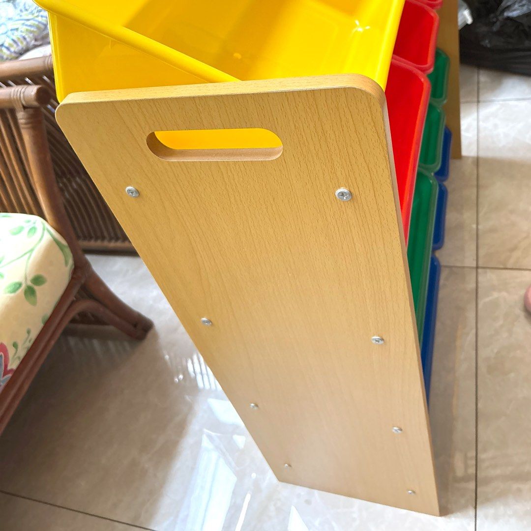 Toy Storage Organizer (Category: Kids Wardrobes & Storage) located in San Juan City. Submitted by stammy8 (Listing ID 1468327612, Image 2). Description: Toy Storage Organizer Measurements86x26.5x78 cm Color : Beech + Plastic Box: Green, Red, Blue, Yellow MaterialsMDF with paper veneer, metal tubes with power coated 12 plastic boxes RFS: Decluttering Pick up as is, cannot disassemble.
