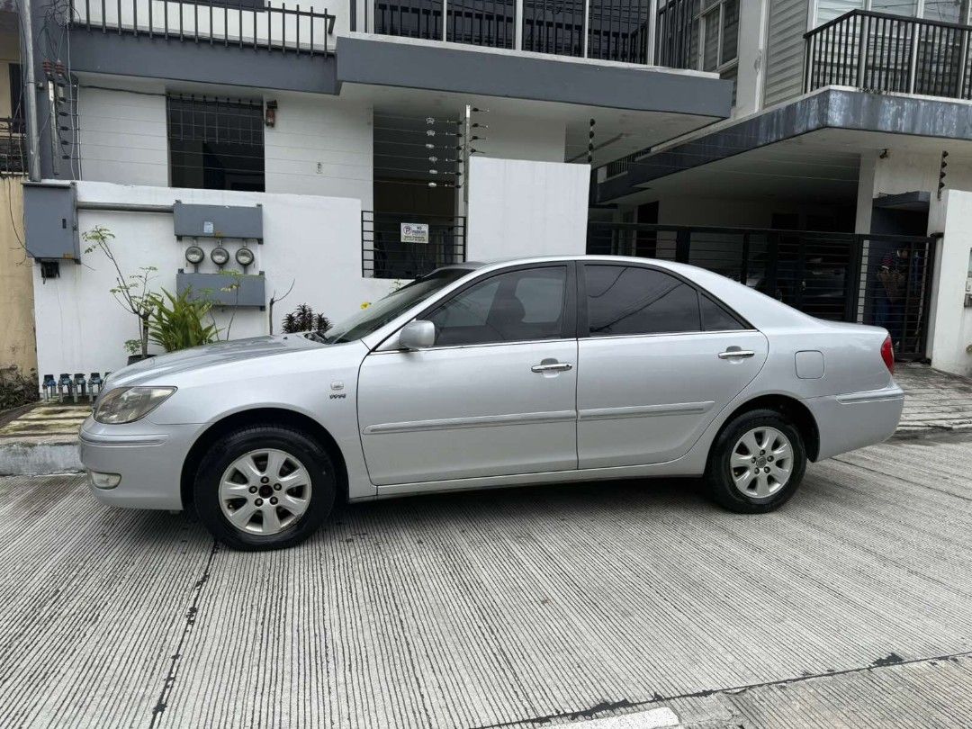 Toyota Camry 2.0 (A) (Category: Used Cars) located in Manila. Submitted by willows.properties (Listing ID 1468353271, Image 3). Description: 2002 Toyota Camry 2.0G Automatic (XV30 Executive Fresh • ALL ORIGINAL) ⭐ Engine: 2.0L VVT-i 16-Valve DOHC Gasoline Engine ⭐ Automatic Transmission ⭐ Mileage: 106,000 km (Low Original Odo) ⭐ Original Paint: Silver Metallic ⭐ Plate Ending in 3 (Tuesday Coding) ⭐ Interior: All-original beige leather seats, wood