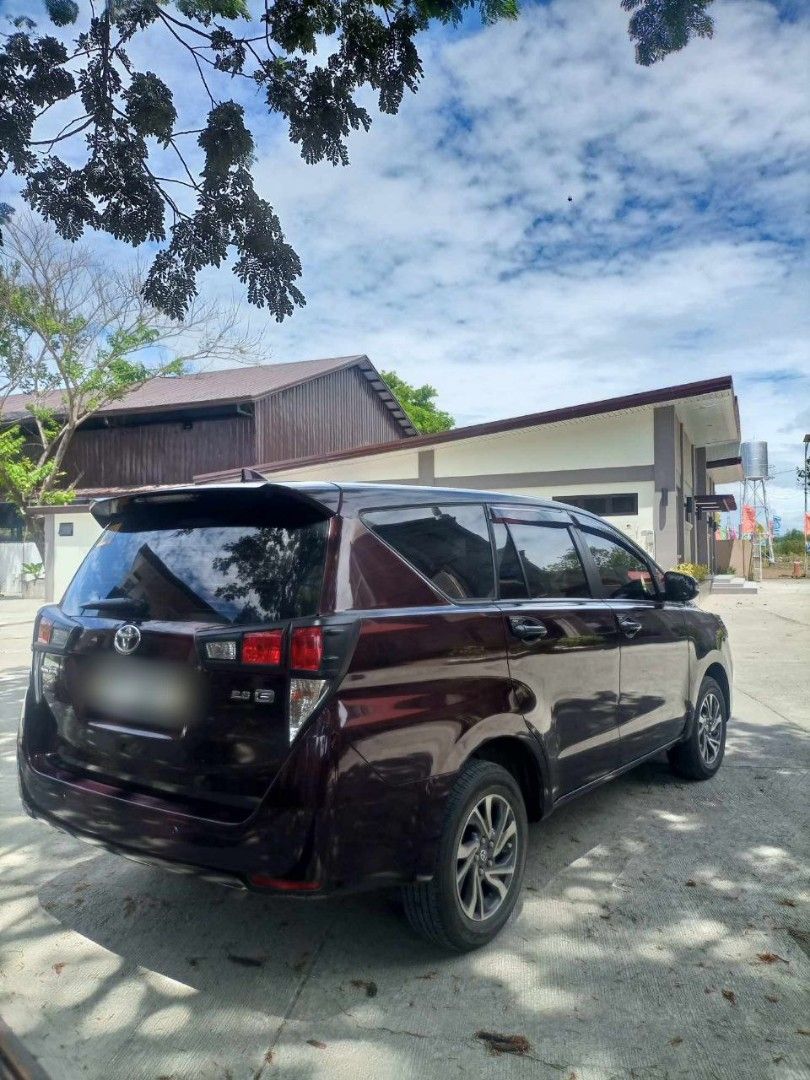 Toyota Innova (Category: Used Cars) located in San Jose del Monte. Submitted by mrs.ca01 (Listing ID 1468408162, Image 3). Description: FOR SALE: 2021 TOYOTA INNOVA 2.8 E AT DIESEL Selling our 2021 Toyota Innova 2.8 E Automatic Diesel for ₱900,000. It has a stated mileage of 22,955 km and comes in Blackies Red. The vehicle is in good condition, subject to actual inspection, with a few light scratches on the body. OR/CR are available. The unit is 