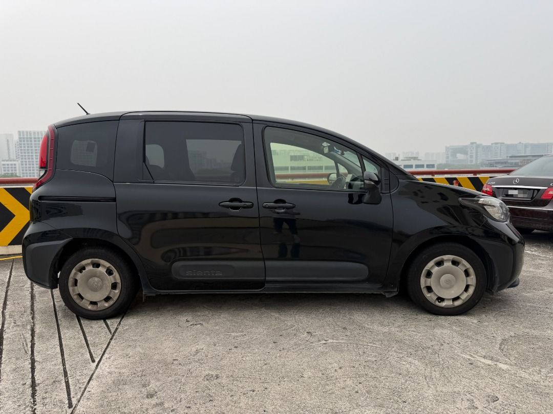 Toyota Sienta Hybrid 1.5 G 7-Seater (A) (Category: Used Cars) located in Singapore. Submitted by onetwo.deal (Listing ID 1468321443, Image 3). Description: 🚗 Toyota Sienta Hybrid 1.5A Standard 💰 Daily Cost from $60+ (Full Loan Available!) 📌 Registration: May 2023 📌 COE Remaining: Approx. 6 Years 6 Months 📌 Ownership: 1st Owner 📌 Colour: Black ✅ Fuel-Efficient Hybrid ✅ Spacious & Practical ✅ Suitable for Family or PHV Use ✅ Full Loan Option 