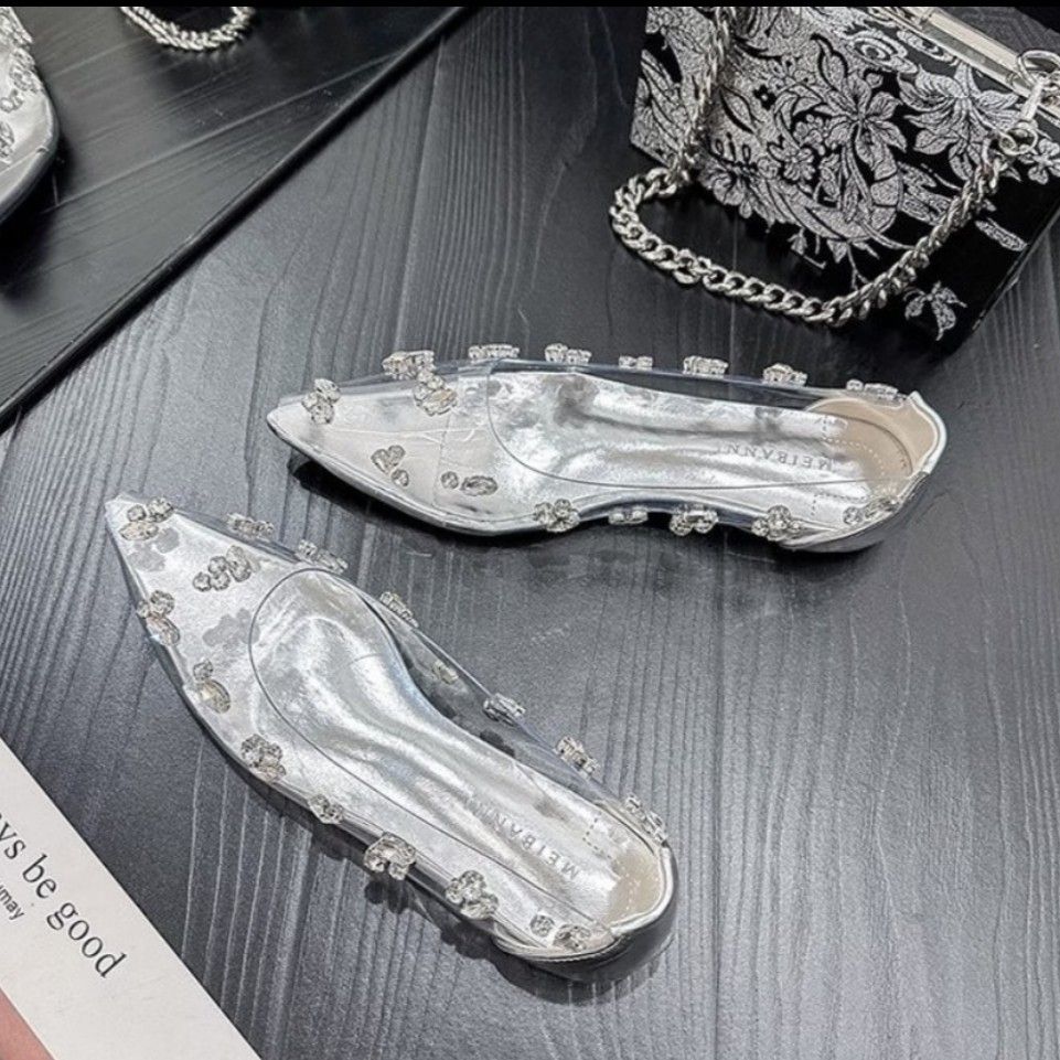 Transparent Rhinestone Pointed Toe Flats (Category: Flats & Sandals) located in Quezon City. Submitted by cuteitemsonlyyy (Listing ID 1468425262, Image 1). Description: - Style: Pointed toe flats with low heels and slip-on design - Material: Clear PVC upper with stylish metallic silver insoles - Details: Dazzling rhinestone clusters on the upper and sides - Condition: Brand new - Mode of Payment: GCash, BPI, or Maya - Shipping: Via J&T Express or