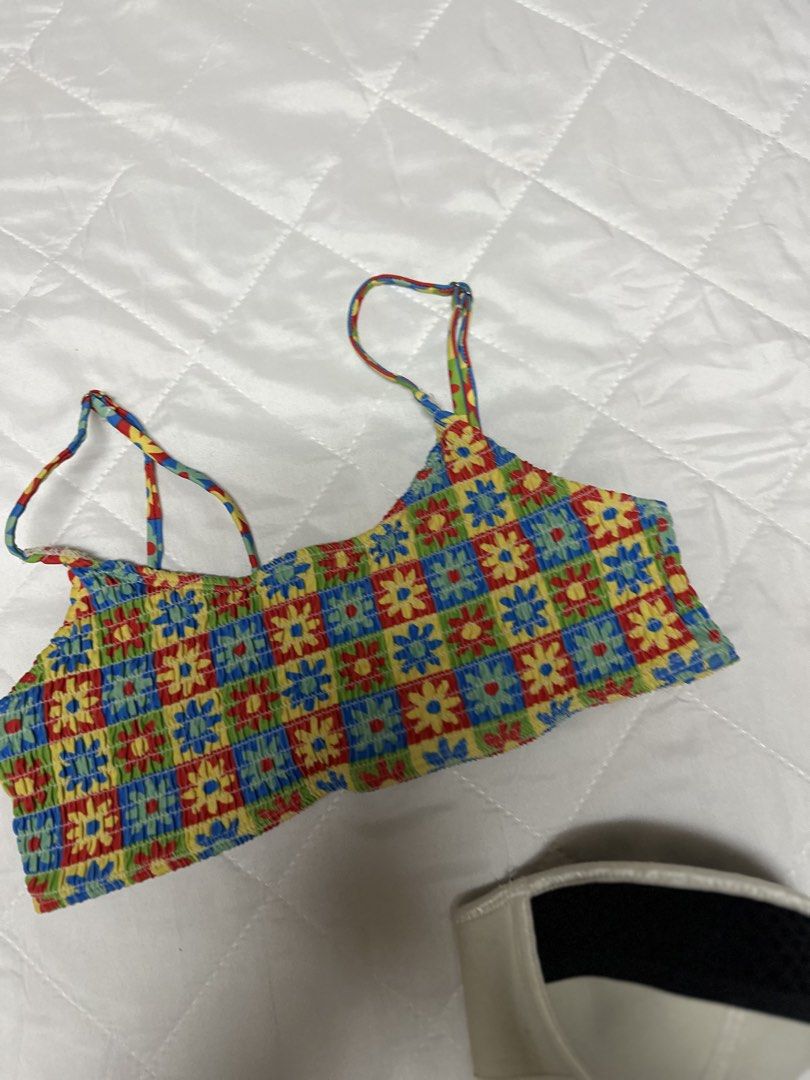 Triangl Bikini Set Size M (Category: Bikinis & Swimsuits) located in Valenzuela. Submitted by prelovedbyramsie (Listing ID 1468421062, Image 2). Description: - Brand: Triangl - Set includes: Colorful floral pattern top with straps and black/cream underwire top with branded clasp - Size: Medium (tagged on floral piece) - Origin: Made in China - Condition: Great mix and match swimwear pieces for beach days.
