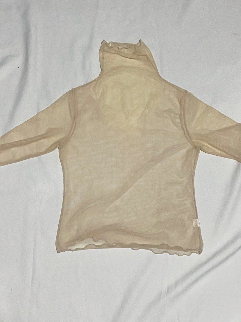 Turtleneck Mesh Top in Beige (Category: Others Tops) located in Makati City. Submitted by weirdshopping (Listing ID 1468294756, Image 2). Description: Selling pre-loved clothes! DETAILS: ~ All items are in good condition. - BRANDED - All clothes are sanitized before delivery. ~ Mode of Payment: Cash & Gcash - Available for delivery c/o by costumer: Lalamove, Grab, Angkas ~ Location: Guadalupe Viejo, Makati ~ FOR meet up, pick up, & delivery! (Del