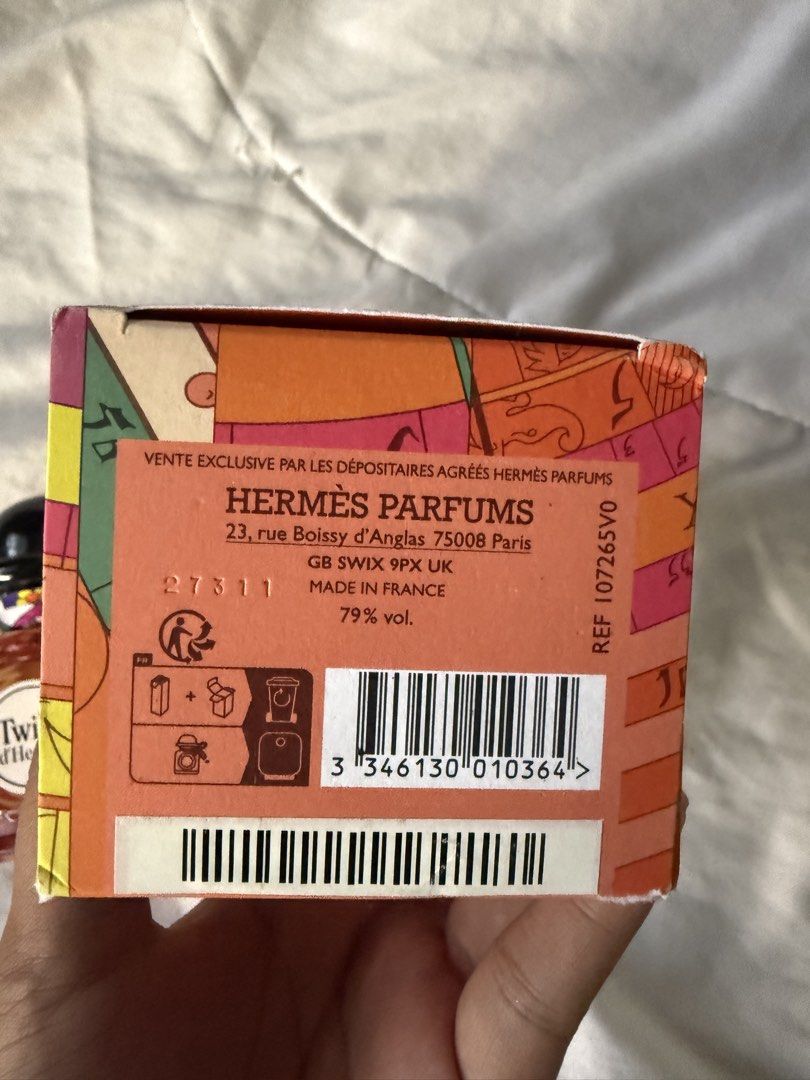 Twilly d'Hermès Eau de Parfum 85ml (Category: Fragrance & Deodorants) located in Batangas. Submitted by gaprelovedthings (Listing ID 1468358151, Image 2). Description: - Authentic Hermès Twilly Eau de Parfum - Generous 85ml bottle size (Natural Spray) - Barely used, liquid level is still very high - Comes with original colorful box packaging - Features signature black cap and iconic silk ribbon tied around the neck - Batch codes clearly visible o