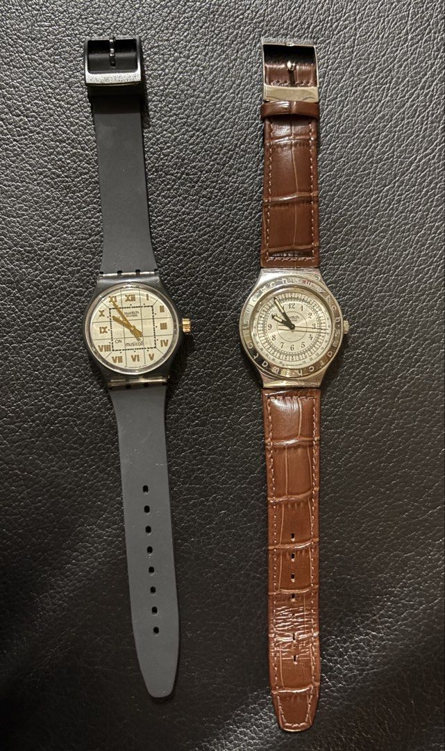 Two Vintage Swatch Watches - bundle sale (Category: Women's Watches) located in Cabanatuan. Submitted by slyheart12345 (Listing ID 1468292632, Image 1). Description: - Set of 2 authentic Swatch wristwatches sold together - Watch 1: Dark grey silicone strap, Roman numerals on a grid dial, and Musicall function - Watch 2: Silver-tone case, detailed inner scale bezel, and glossy brown crocodile-embossed leather strap - Closure: Classic pin buckle on