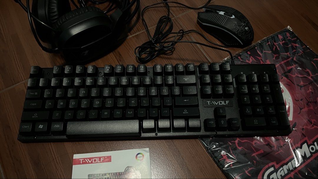 T-Wolf TF-400 4-in-1 Gaming Combo Kit (Category: Computer Keyboard) located in Manila. Submitted by cansitcanton (Listing ID 1468419197, Image 2). Description: - 4-in-1 gaming combo kit: keyboard, mouse, headset, and mousepad - Plug and play setup, perfect for PC gaming - Includes original box and manual - Ready to use to complete your desktop setup -Only Mouse Used.