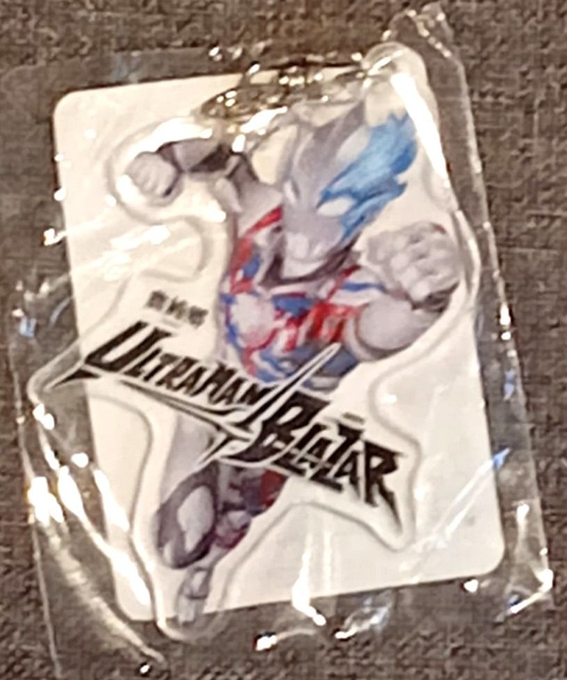 Ultraman Blazar Acrylic Keychain (Category: Character Goods) located in Makati City. Submitted by winsell76 (Listing ID 1468303121, Image 1). Description: - Official Ultraman Blazar merchandise featuring character artwork and logo - Brand new, sealed in original plastic packaging with backing card - Includes holographic authenticity sticker for verification - Compact and lightweight, ideal for keys, bags, or lanyards - Must-have collectible piece