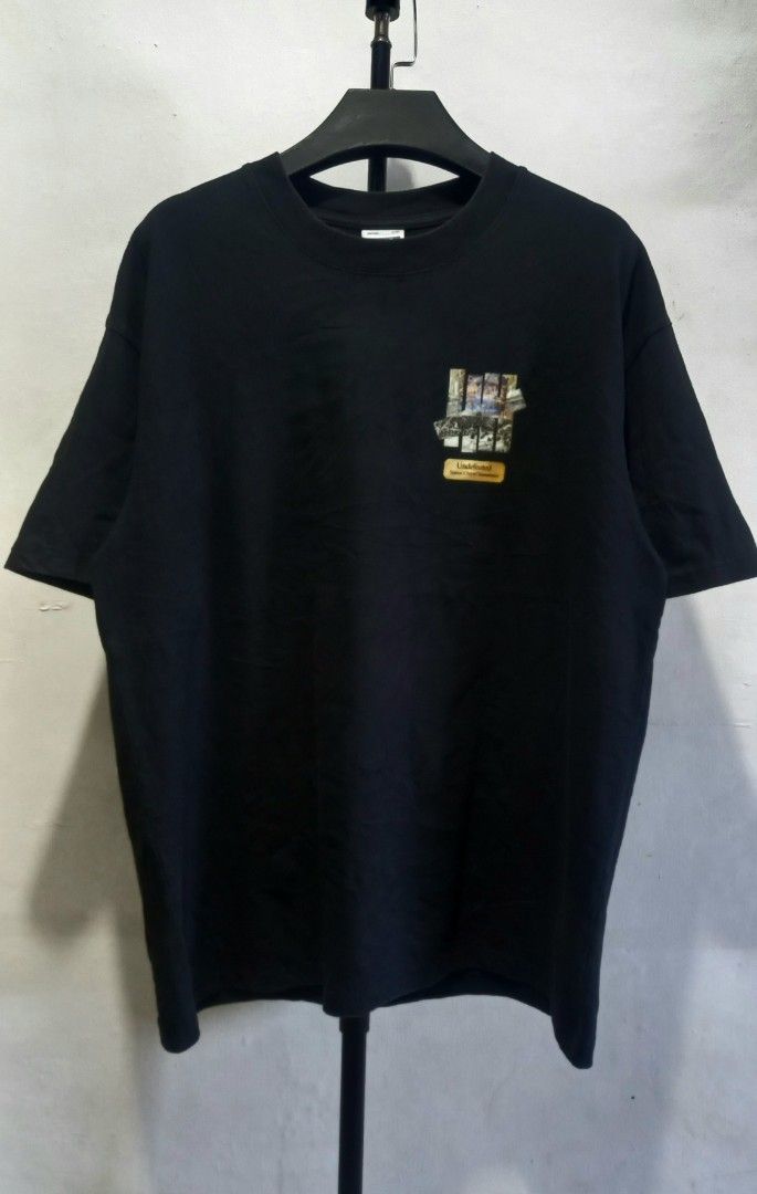 Undefeated Black Graphic Tee Large (Category: Tshirts & Polo Shirts ) located in Tarlac. Submitted by den420 (Listing ID 1468284089, Image 1). Description: - Brand: Undefeated - Color: Black - Size: Large (tag attached) - Material: 100% Cotton, Made in USA - Design: Small chest logo on front, large framed artwork print on back - Condition: Brand new with tags.